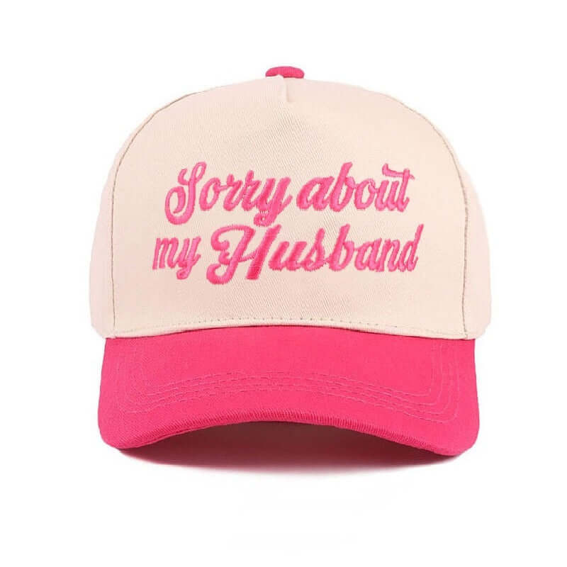 SORRY ABOUT MY HUSBAND HAT (6 colors) in cream and hot pink with embroidered script for a fun statement look.