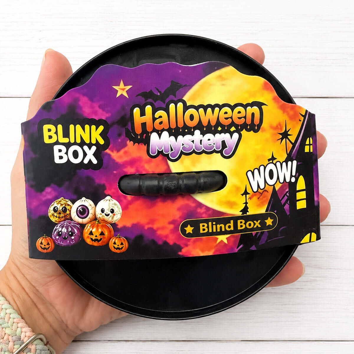 Halloween Dumpling Halloween Mystery Blind Box with spooky designs and tiny decorations in hand.