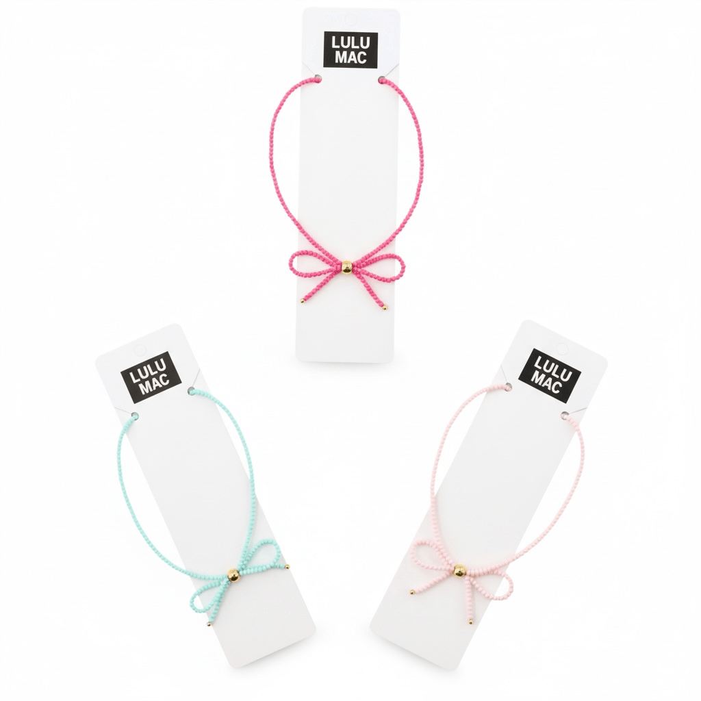 LULU MAC - Love Ties Necklace in hot pink, aqua, and light pink with bow design for a super cute, versatile look.