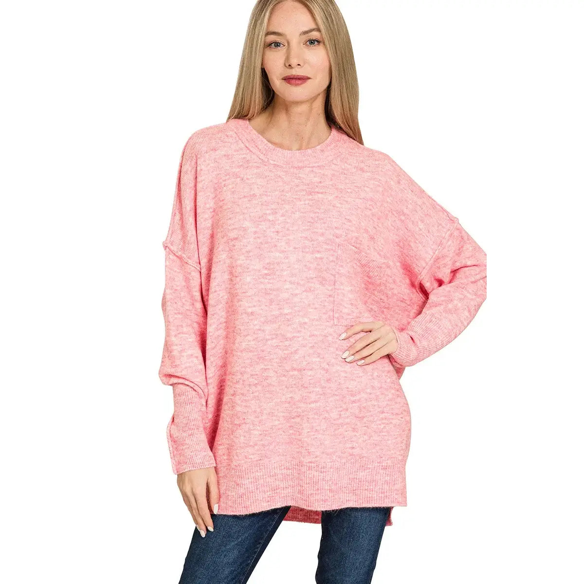 Model wearing the SWEET HAVEN TOP in pink, showcasing a relaxed fit and cozy design with a hi-low hem.