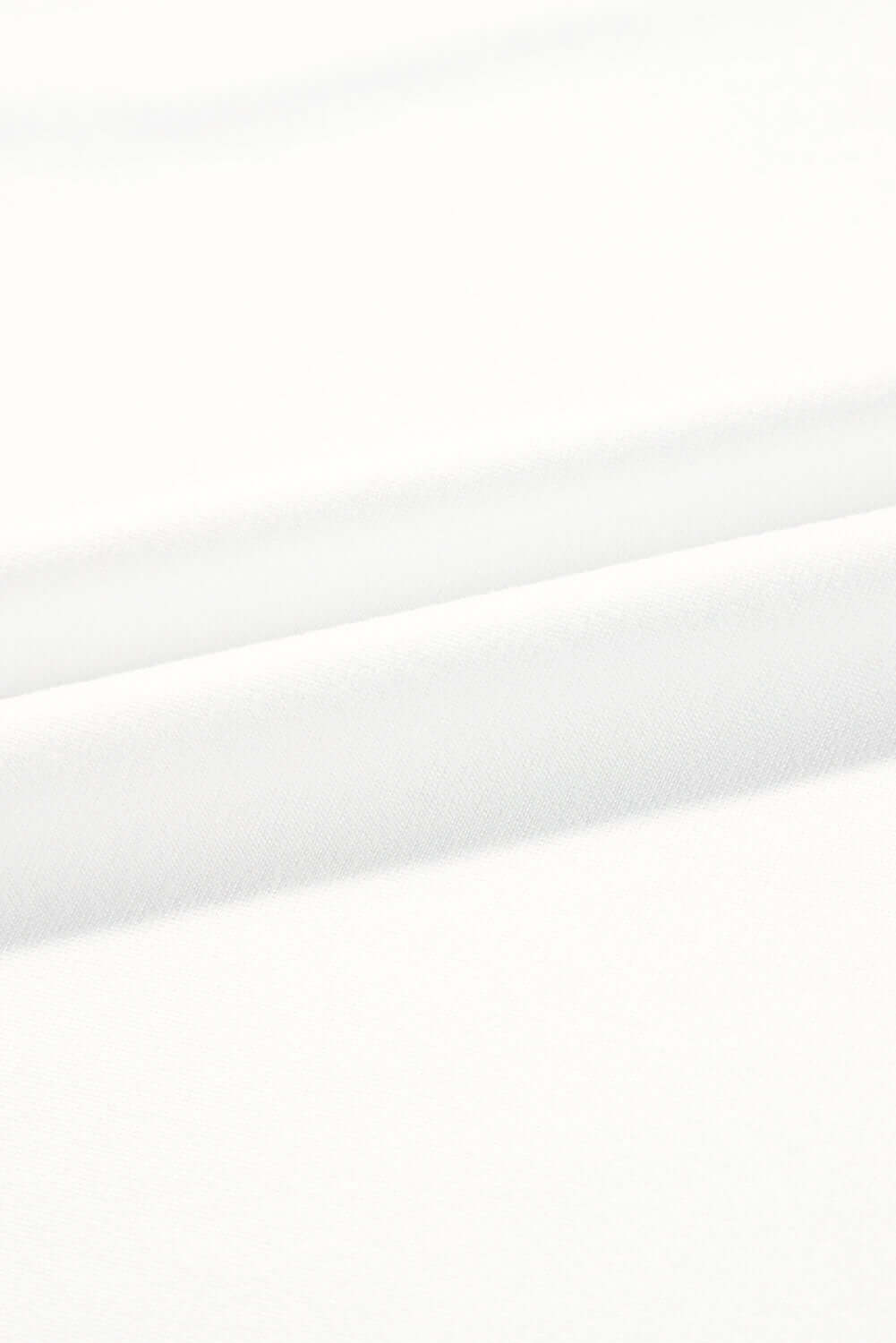 Close-up of soft, smooth white fabric, ideal for comfortable lounge wear and casual clothing.