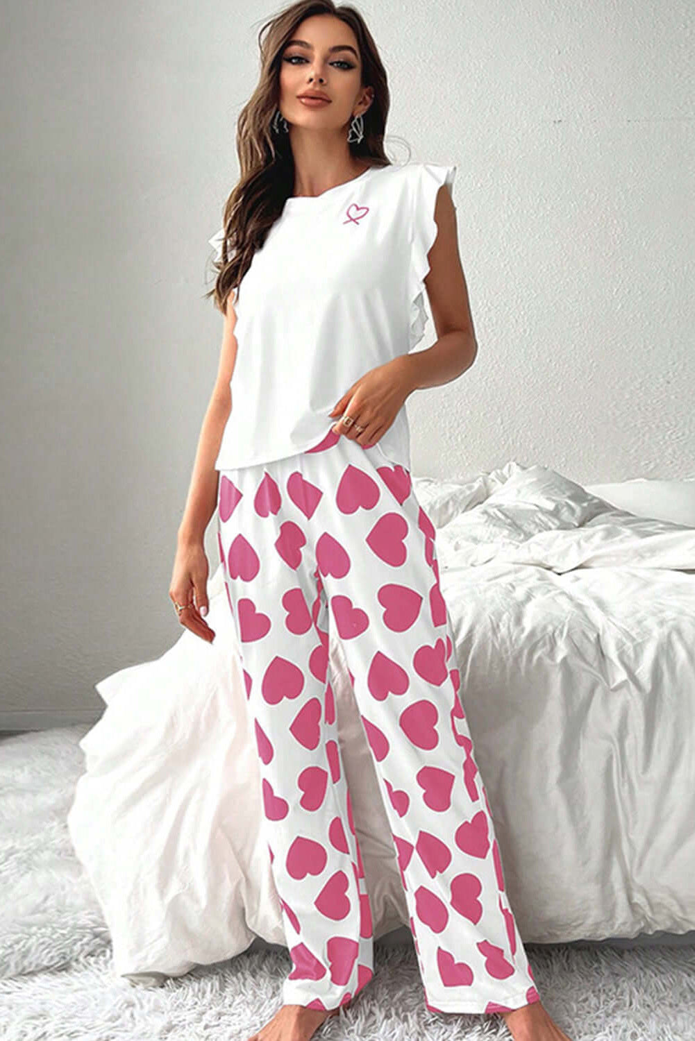 Love Language Lounge Set in pink with ruffled tank top and heart-print lounge pants, perfect for cozy nights.