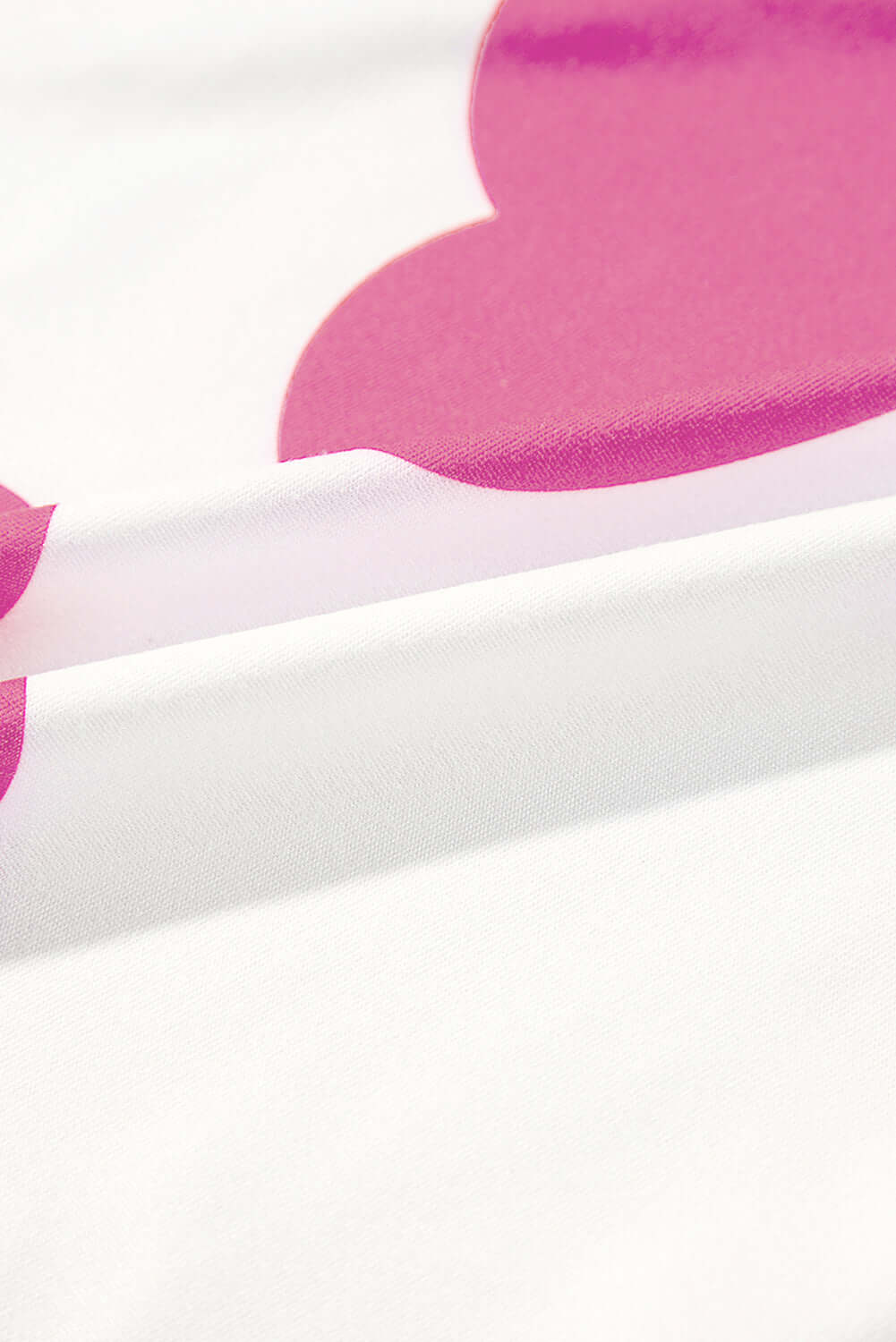 Close-up of soft fabric with pink heart pattern, showcasing the romantic design of the Love Language Lounge Set.