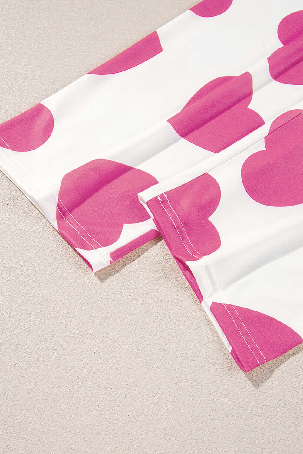 Pink heart-print lounge pants detail from the Love Language Lounge Set.