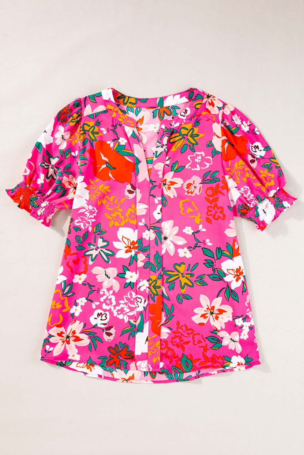 Paradise Petals Top: Vibrant rose floral printed blouse with split V-neck and puff sleeves.