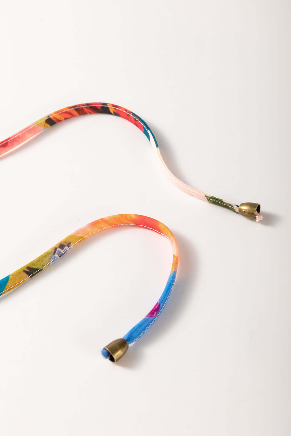 Colorful floral straps with golden tips, perfect for adding a vibrant touch to any outfit.