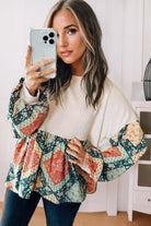PATCHWORK POETRY TOP featuring geometric patchwork design with cozy bubble sleeves and relaxed fit.