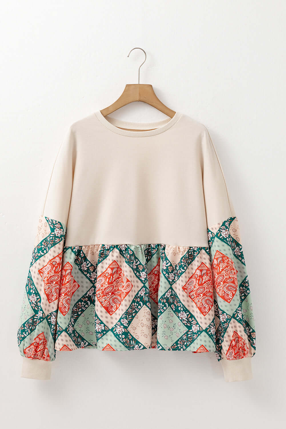 PATCHWORK POETRY TOP featuring geometric patchwork design with bubble sleeves and cozy fit, perfect for fall.