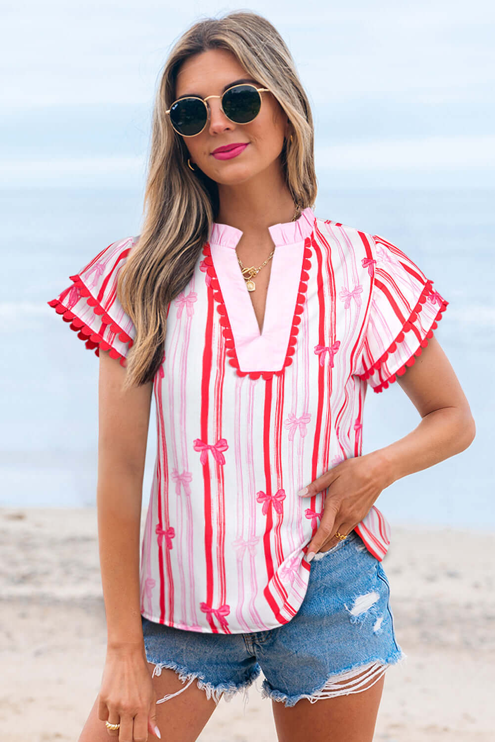 Flirty Ribbon Reign Top with pink bow print and ric-rac trim, perfect for warm weather and stylish casual looks.