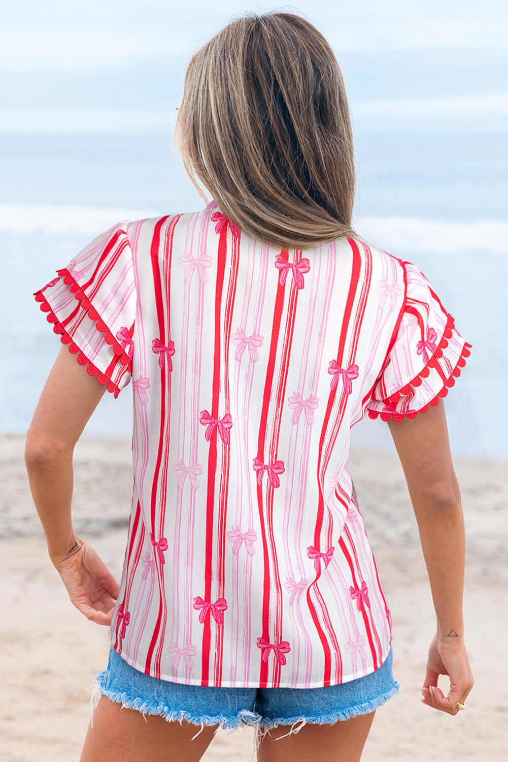 Back view of the Ribbon Reign Top featuring a striped bow print and ric-rac trim, perfect for warm weather.