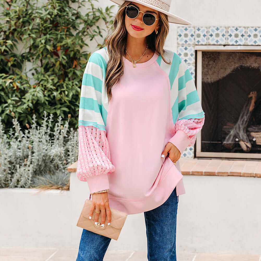 SWEET ESCAPE TOP featuring a colorful striped colorblock design in playful pastel tones with a loose fit pullover style.