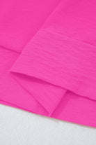 GRACEFUL GLOW TOP (bright pink) fabric close-up showcasing vibrant color and texture.