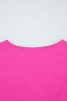Back view of the GRACEFUL GLOW TOP (bright pink) showing the elegant neckline and vibrant color.