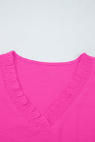 GRACEFUL GLOW TOP (bright pink) showing elegant frilled V-neckline and vibrant color.
