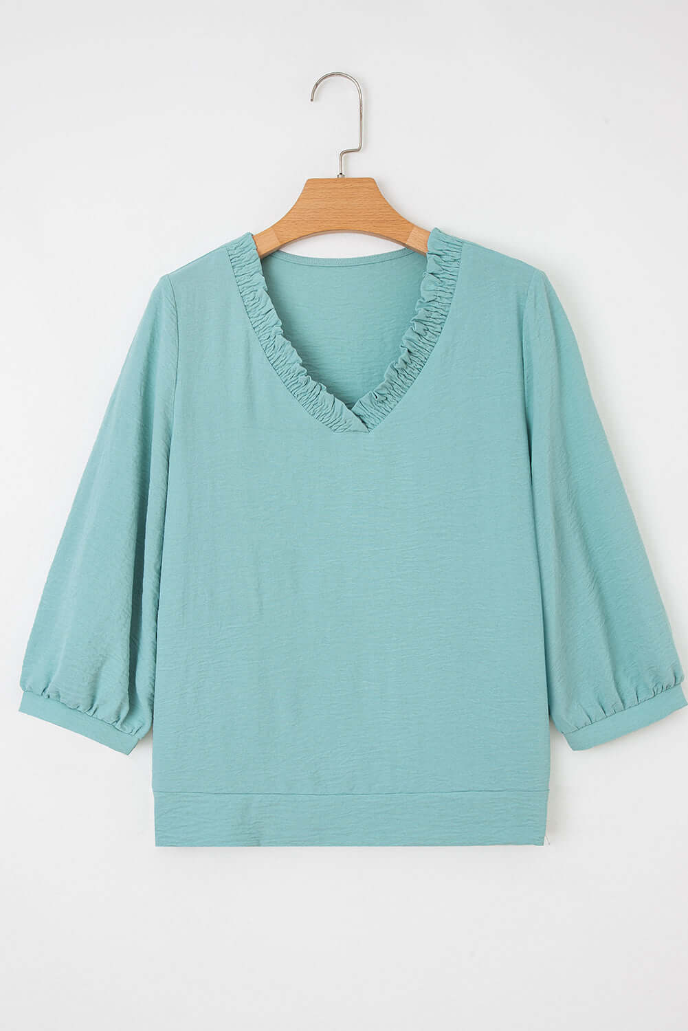 GRACEFUL GLOW TOP (jade sea) featuring a frilled V-neckline and bracelet sleeves in a trendy jade sea color.