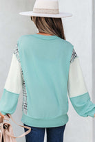 Aqua Avenue Top: Back view of a ribbed pullover with plaid patchwork design and relaxed fit.