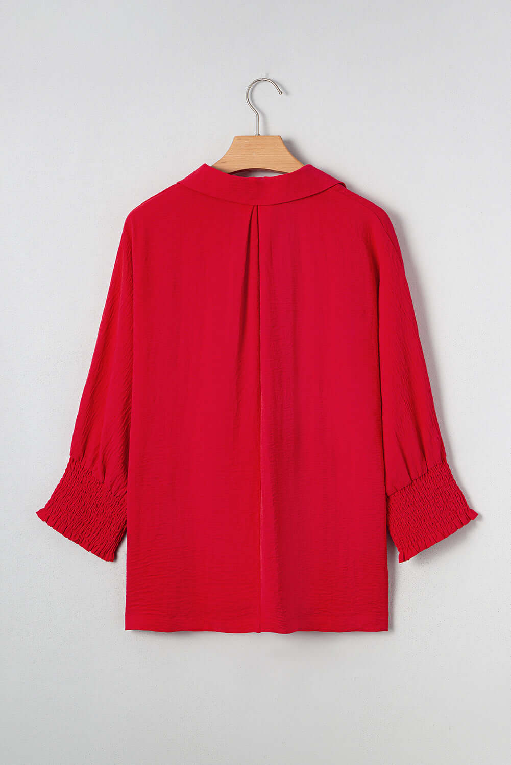 Back view of the TRUE PASSION TOP in fiery red, featuring shirred 3/4 sleeves and a collared neck design.