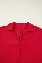 TRUE PASSION TOP in fiery red with a flattering V-neck and collared detail, showcasing chic comfort and style.