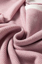 Soft knit texture of the BLUSHLINE BEAUTY TOP in blush pink, showcasing its cozy comfort and stylish design.