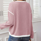 Back view of BLUSHLINE BEAUTY TOP showcasing the soft blush hue and stylish contrast trim detail.