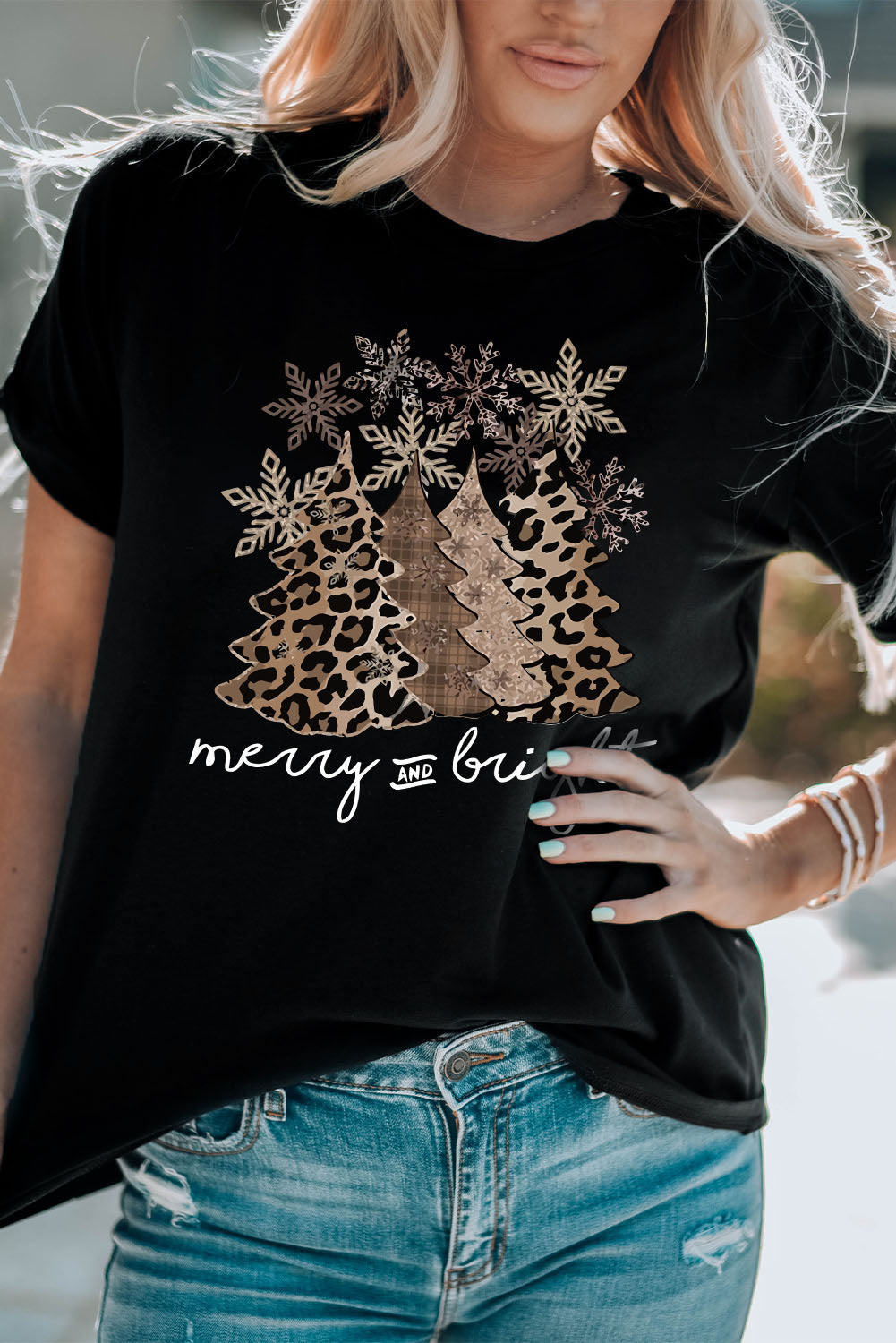 Merry & Bright Leopard Tee featuring a festive tree graphic and leopard print design, perfect for holiday outfits.