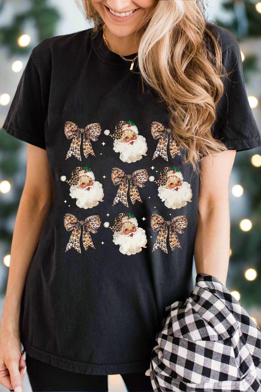 Festive black T-shirt featuring Santa and leopard print bows, perfect for holiday celebrations.