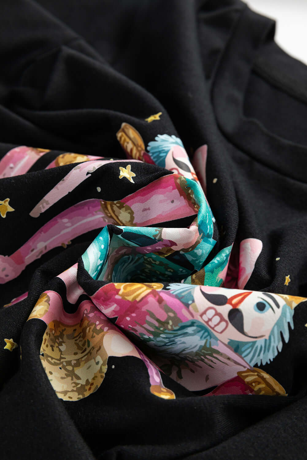 Festive Nutcracker patterned fabric of the Dance of the Nutcracker T-shirt, perfect for holiday wear.