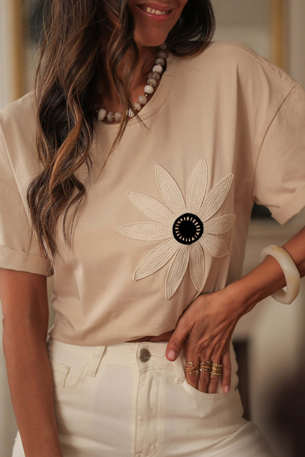 Model wearing Morning Daisy Crochet Floral Tee with crochet daisy graphic and relaxed fit.