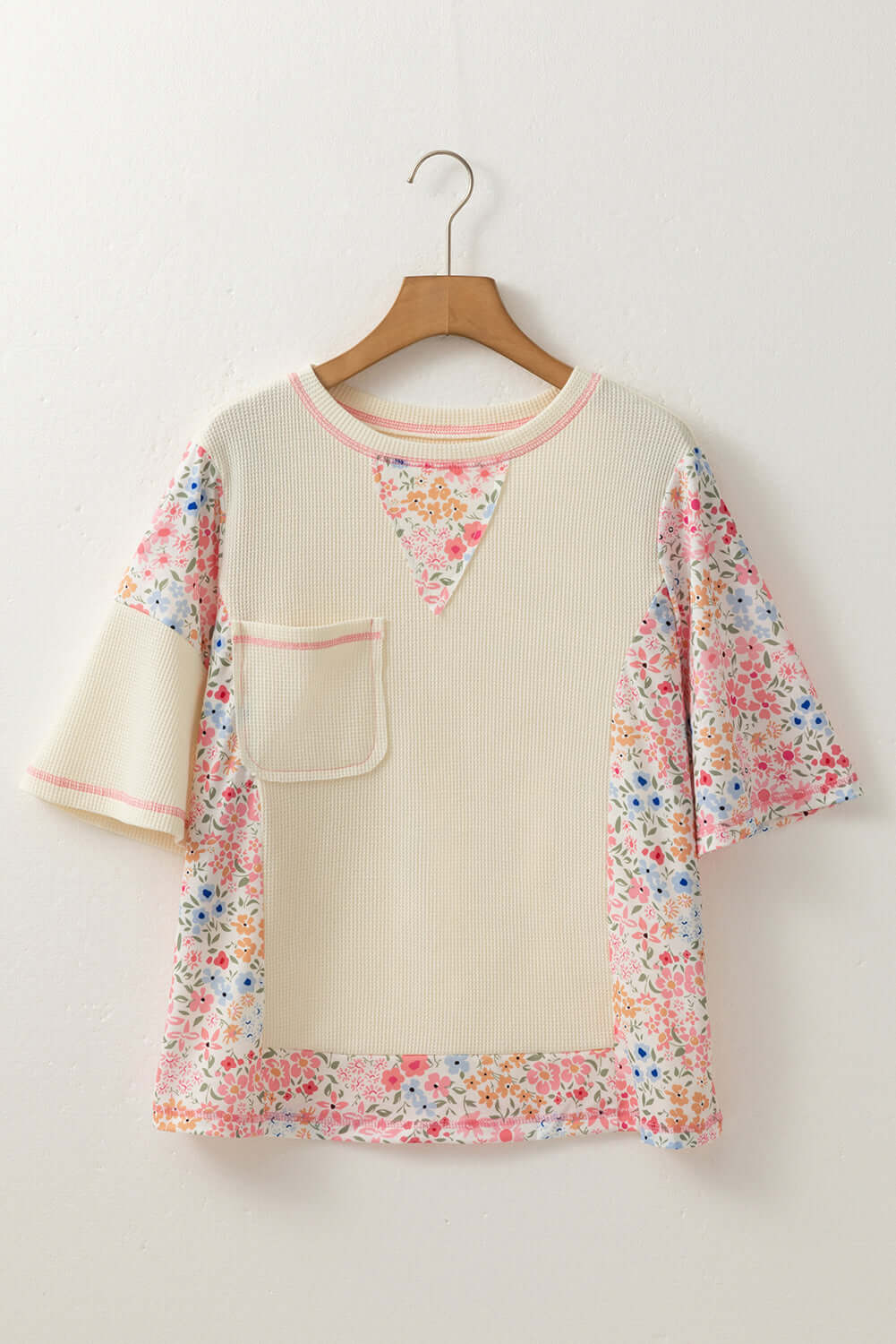 Beige waffle knit top with floral accents, perfect for casual outings and breezy porch mornings.