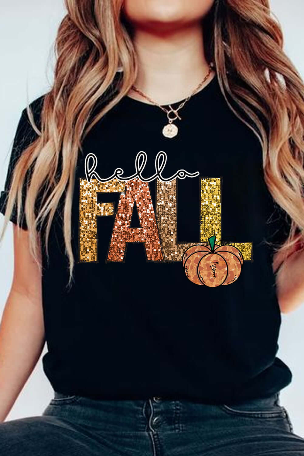 Black HELLO FALL TEE featuring glittery lettering and a pumpkin graphic, perfect for autumn festivities and cozy days.
