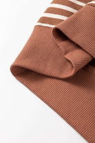 Close-up of MAPLE CIDER CREWNECK TOP showcasing the brown stripe colorblock design and soft, cozy fabric detail.