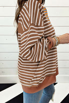 Side view of a woman wearing a MAPLE CIDER CREWNECK TOP with brown stripe colorblock design, showcasing its relaxed fit and style.