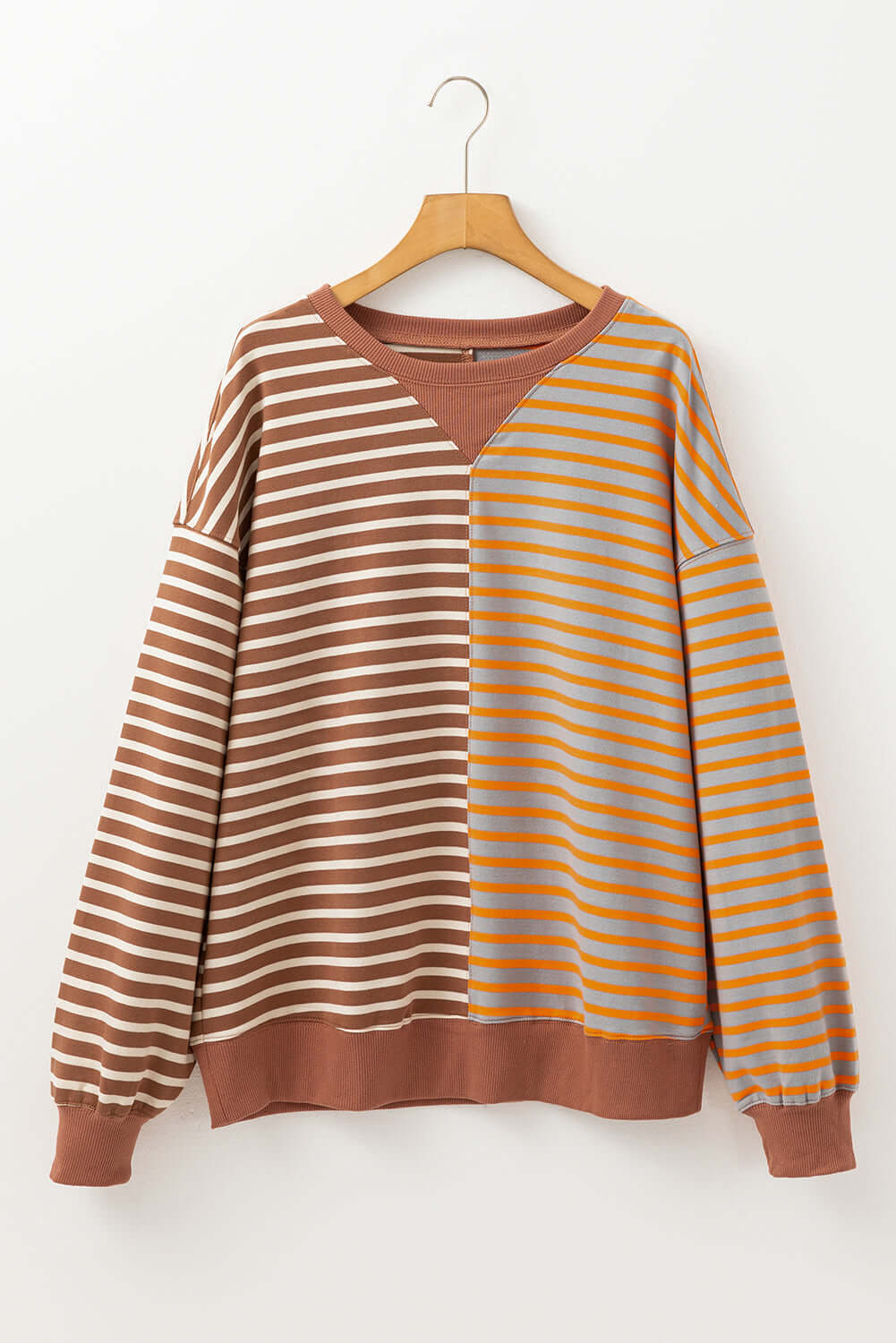 MAPLE CIDER CREWNECK TOP featuring a colorblock stripe design in brown and orange tones for a trendy autumn look.