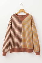 MAPLE CIDER CREWNECK TOP featuring a colorblock stripe design in brown and orange tones for a trendy autumn look.
