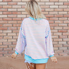 Back view of the SALTWATER TAFFY TOP in soft pink and aqua stripes with contrast trim.