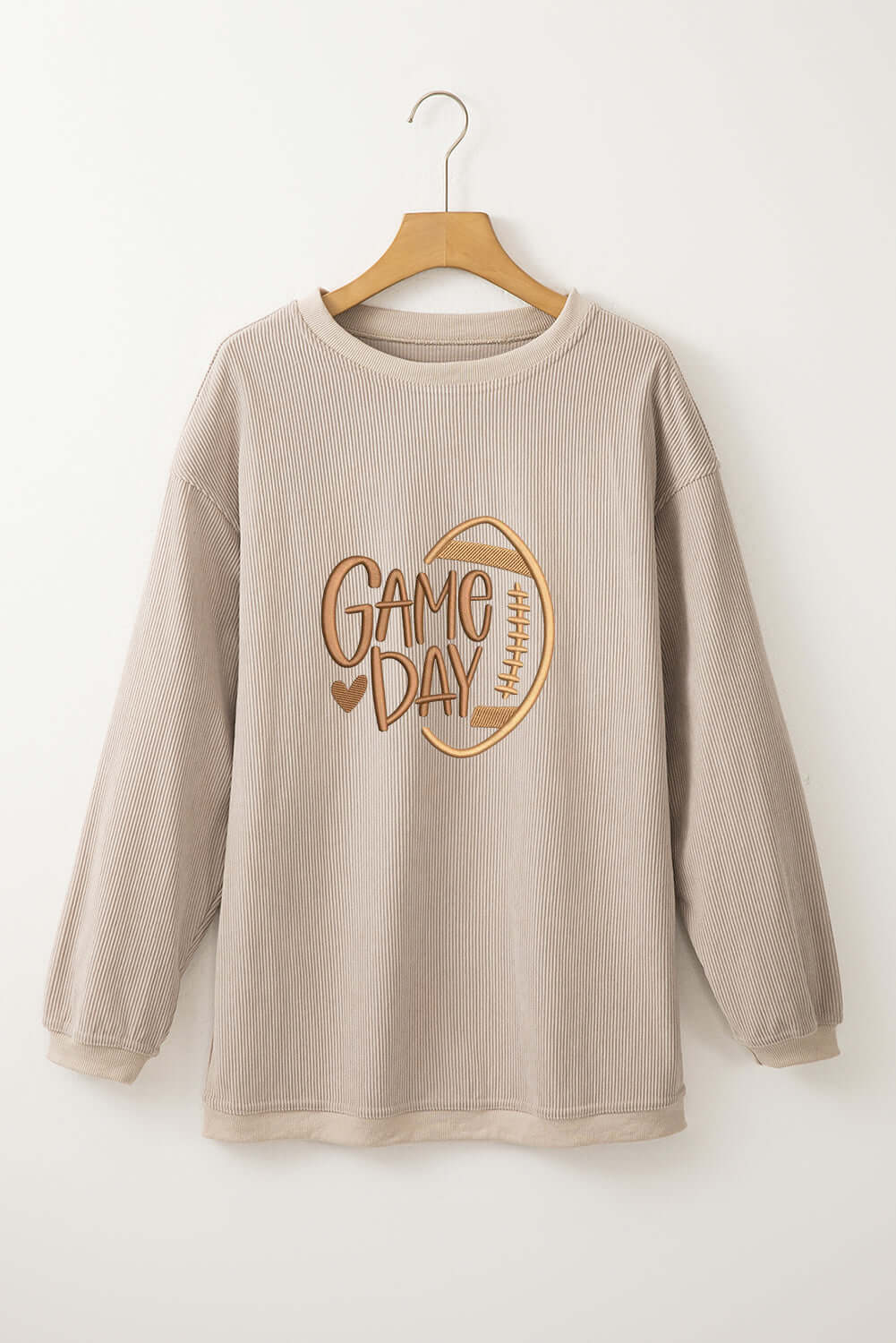LOVE OF THE GAME CORDED CREW in Harvest Beige with embroidered 'Game Day' design on display.