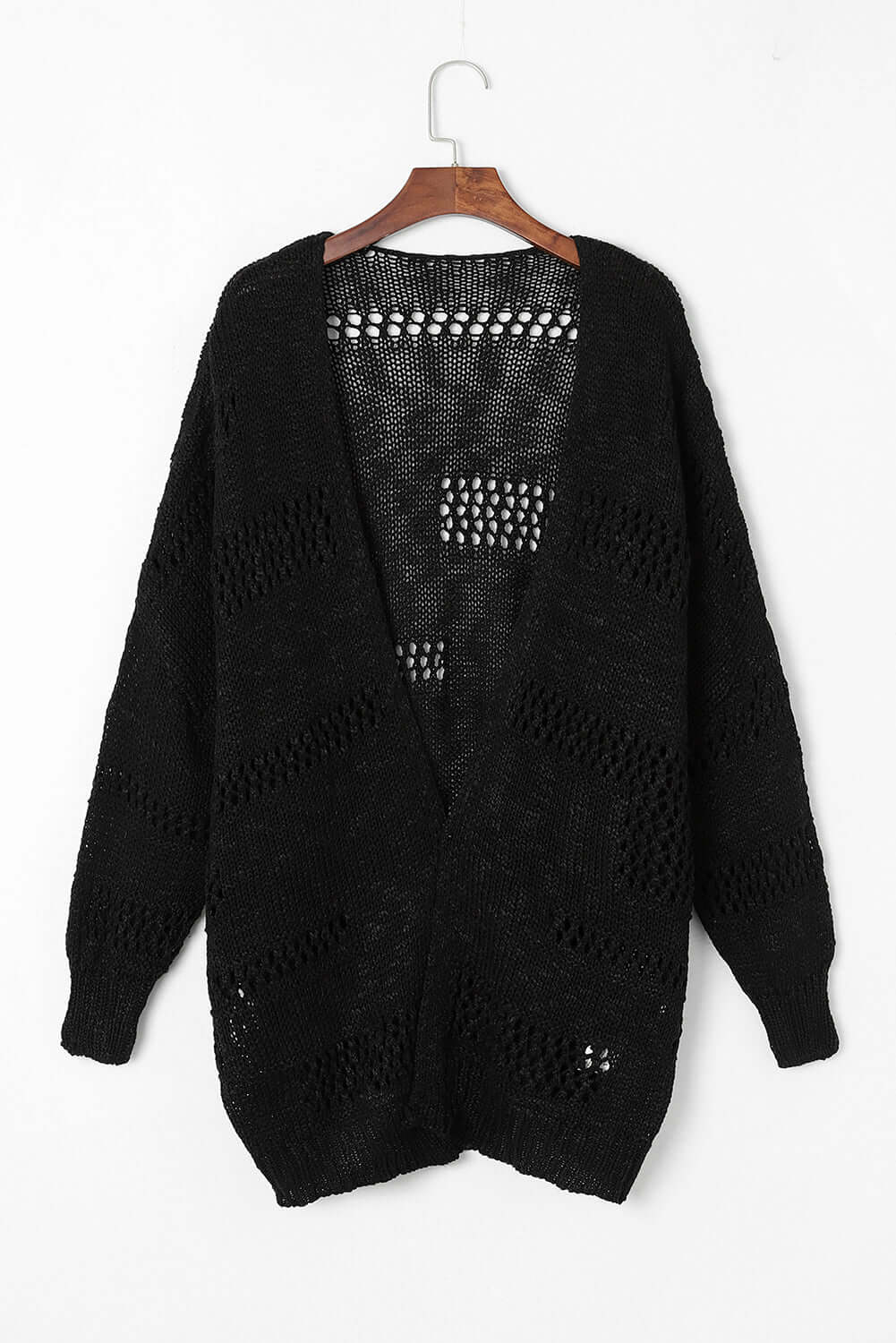 Blackout Bliss Cardigan in black, featuring open cable-knit design and relaxed dolman sleeves.