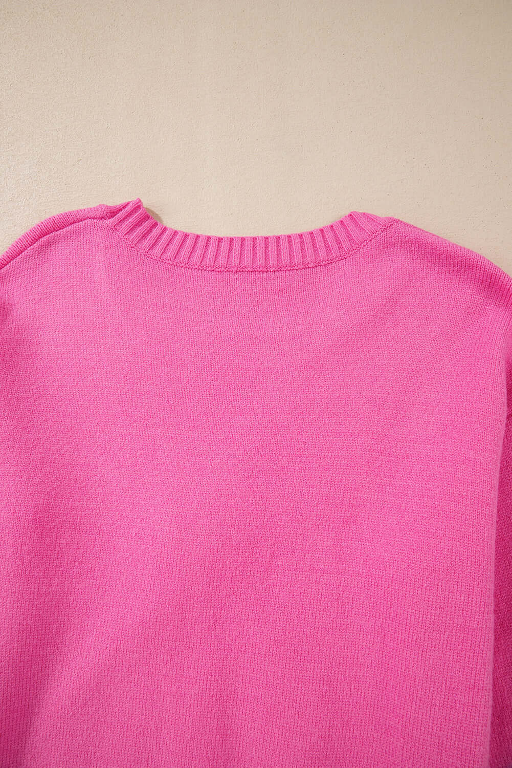 Back view of soft pink TRIP TO REMEMBER sweater with ribbed neckline, perfect for trendy comfort.