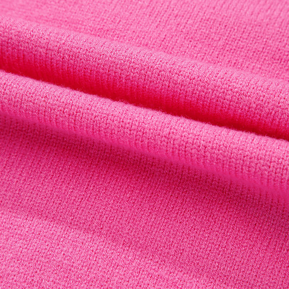 Close-up of a soft pink fabric showcasing the texture of the TRIP TO REMEMBER Sweater.