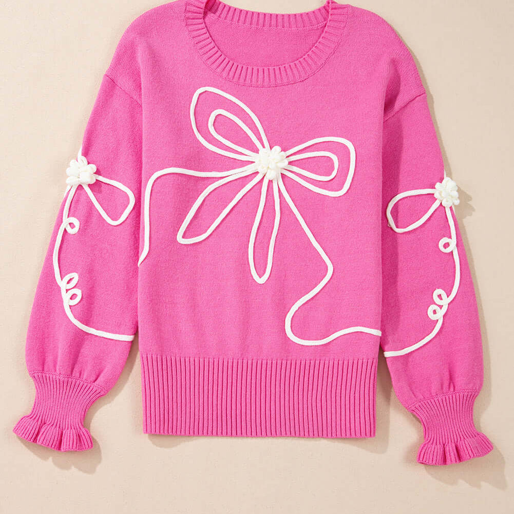 Beautiful pink TRIP TO REMEMBER Sweater with corded bow accents and ruffled cuffs, perfect for adding charm to any outfit.