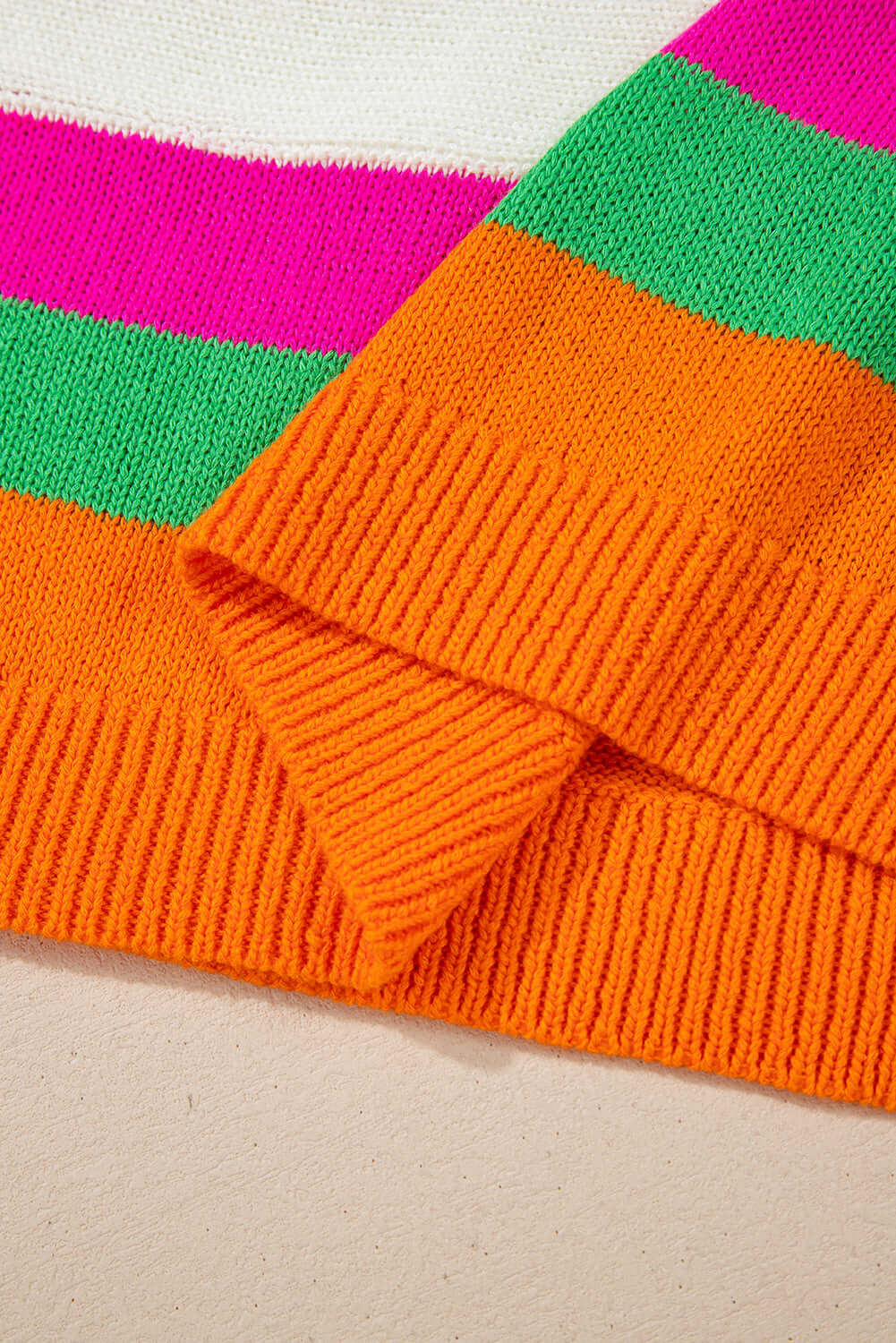 Colorblock design and vibrant stripes of the STARSTRUCK SWEATER highlighting its playful charm and cozy style.