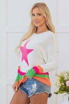 Stylish model wearing the STARSTRUCK SWEATER with bold star design and vibrant colorblock stripes.
