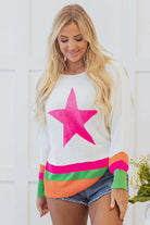 STARSTRUCK SWEATER featuring a playful star design and vibrant colorblock edges, styled with shorts and a cheerful smile.
