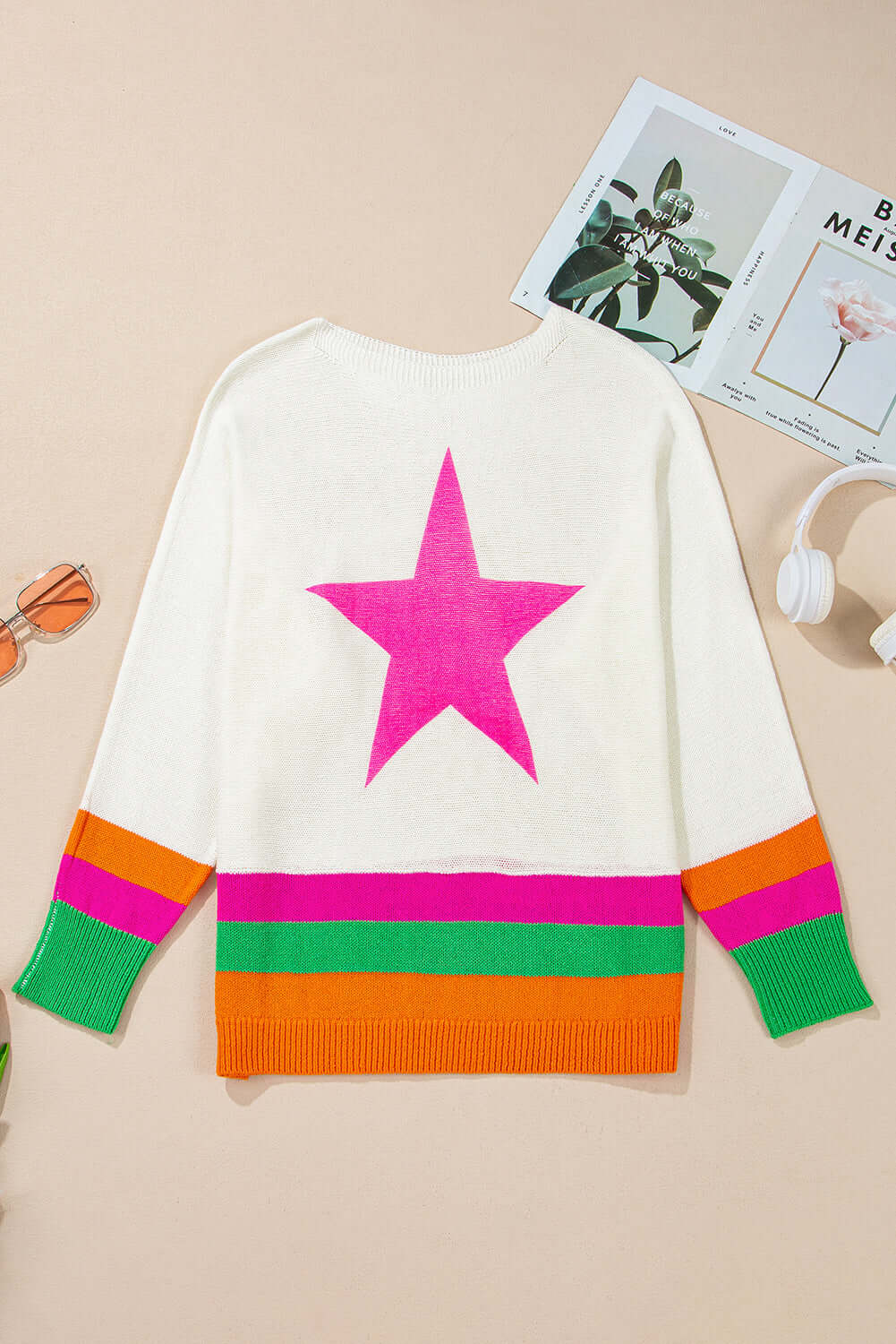 Back view of STARSTRUCK SWEATER with vibrant colorblock stripes and a bold pink star design.
