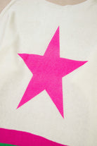 STARSTRUCK SWEATER featuring a bold pink star design on a soft, colorblock knit fabric.