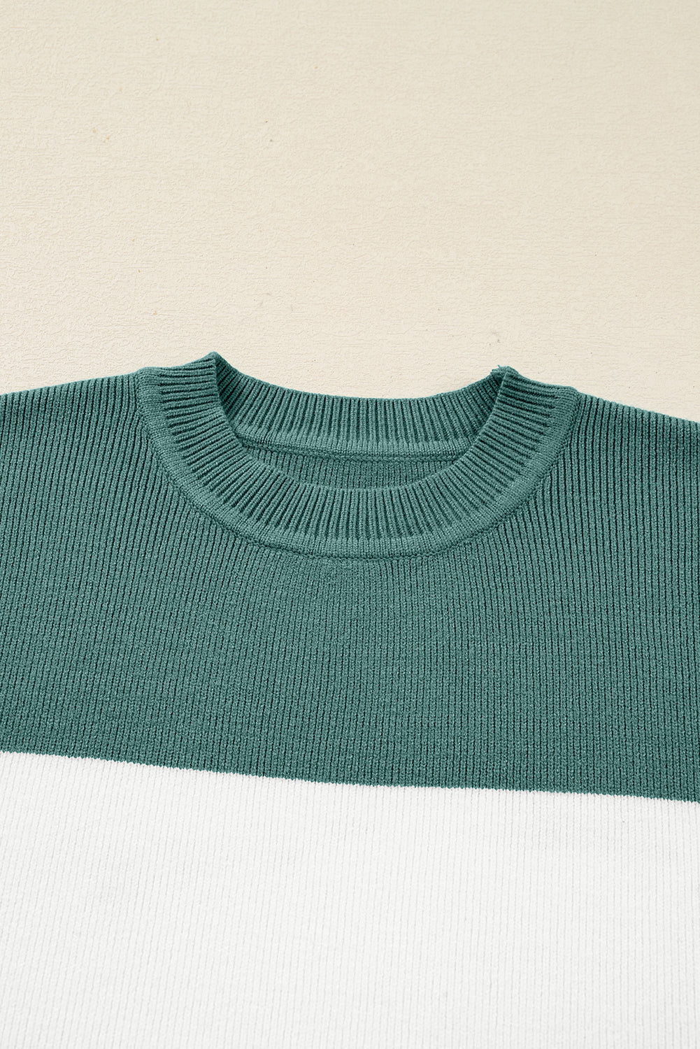 MOUNTAIN AIR SWEATER close-up texture in Marina Blue and Cream color block design on a soft knit fabric.