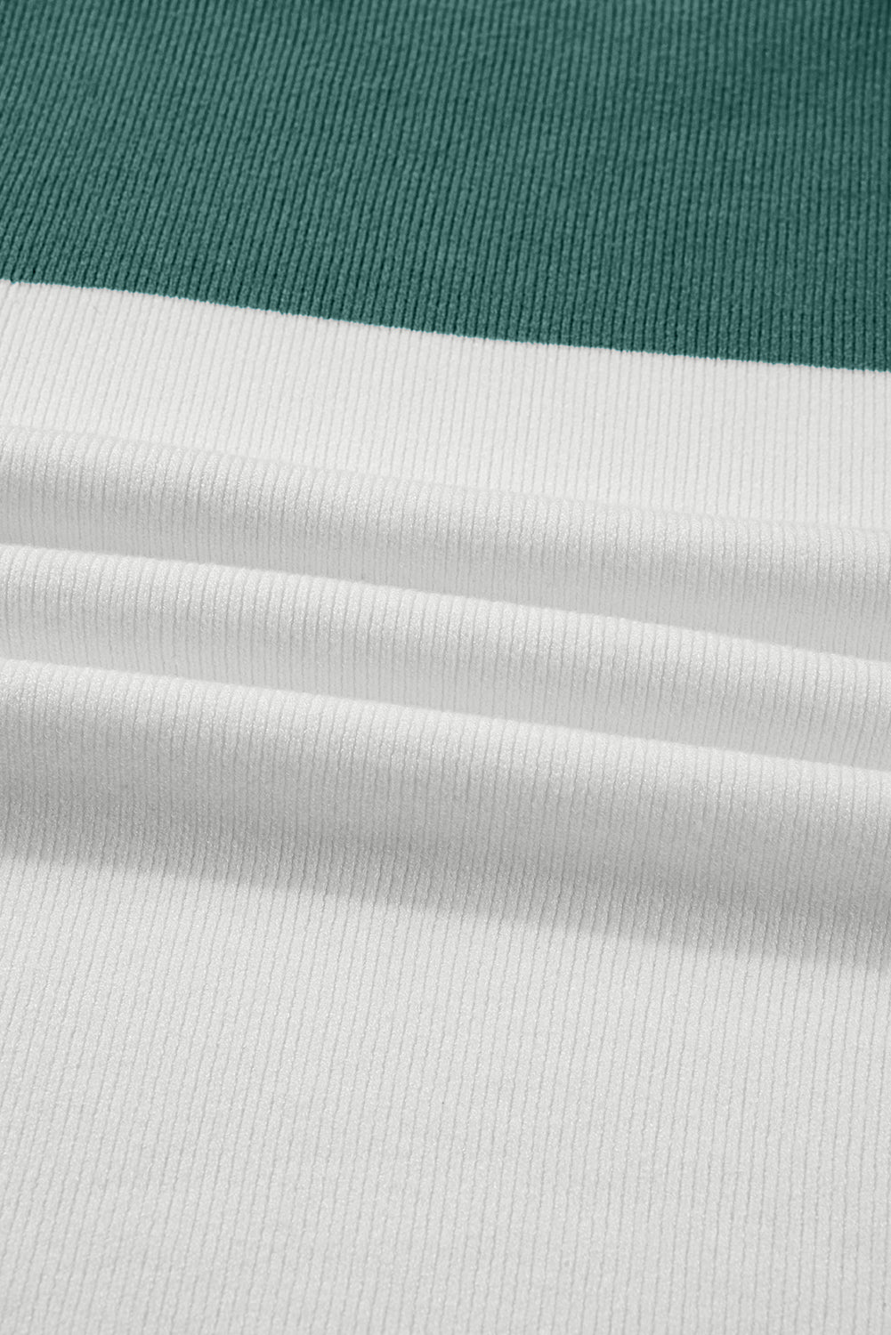 Close-up of the ribbed knit fabric in Marina Blue, Khaki and Cream for the MOUNTAIN AIR SWEATER.