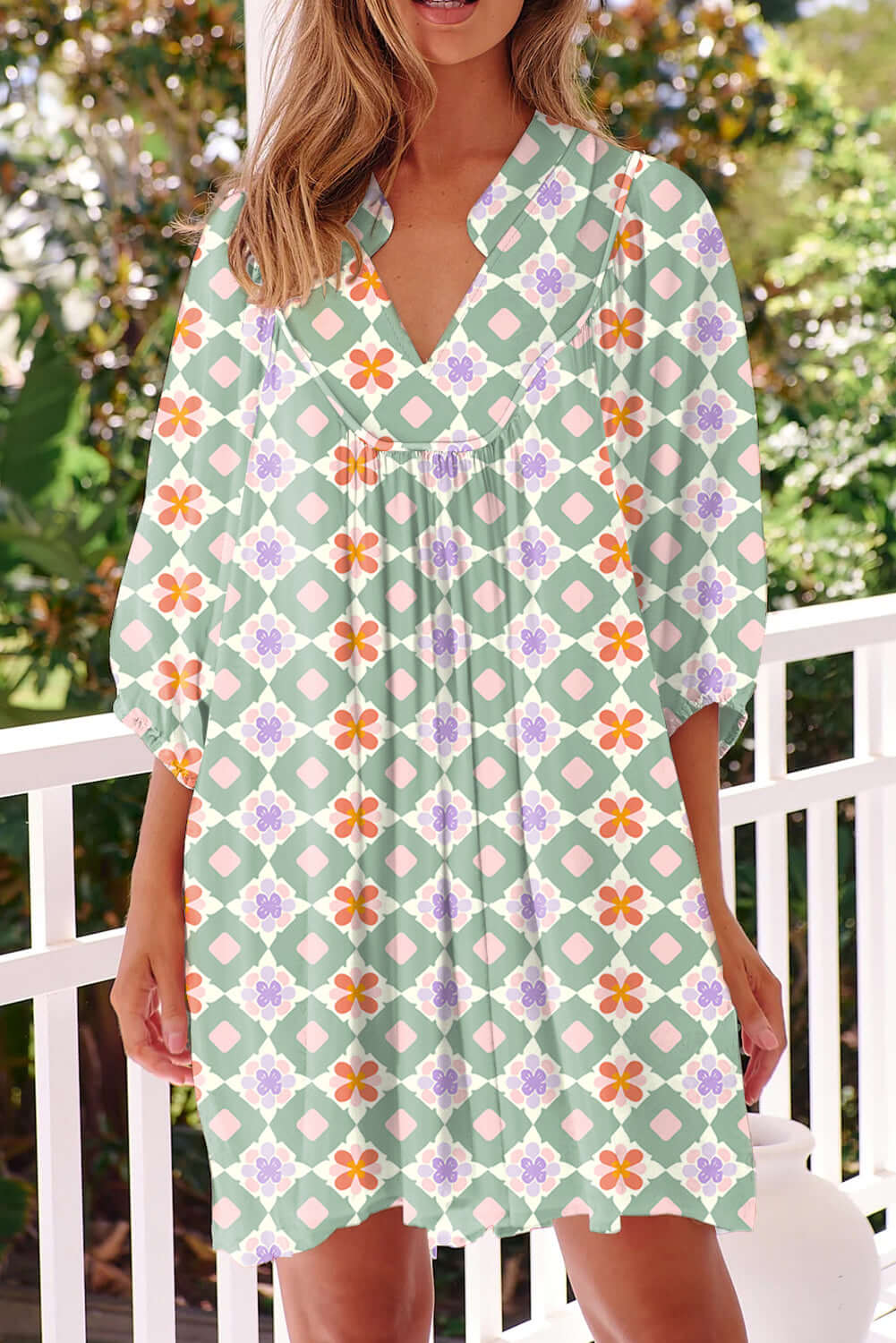 Mint Mosaic Dress with green geometric floral pattern, knee-length, loose fit, and 3/4 puff sleeves.