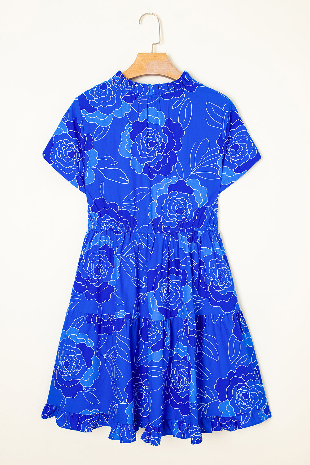 Vivid blue floral dress with tiered skirt and short sleeves, perfect for a playful feminine look.
