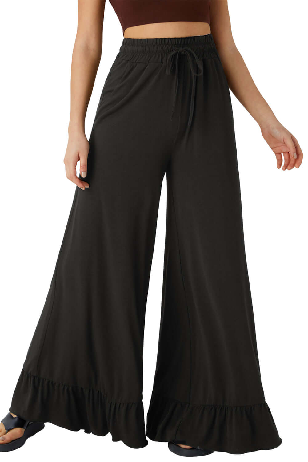 CHARMED COMFORT WIDE LEG PANTS in black, featuring a high waist and ruffled hem for stylish comfort.